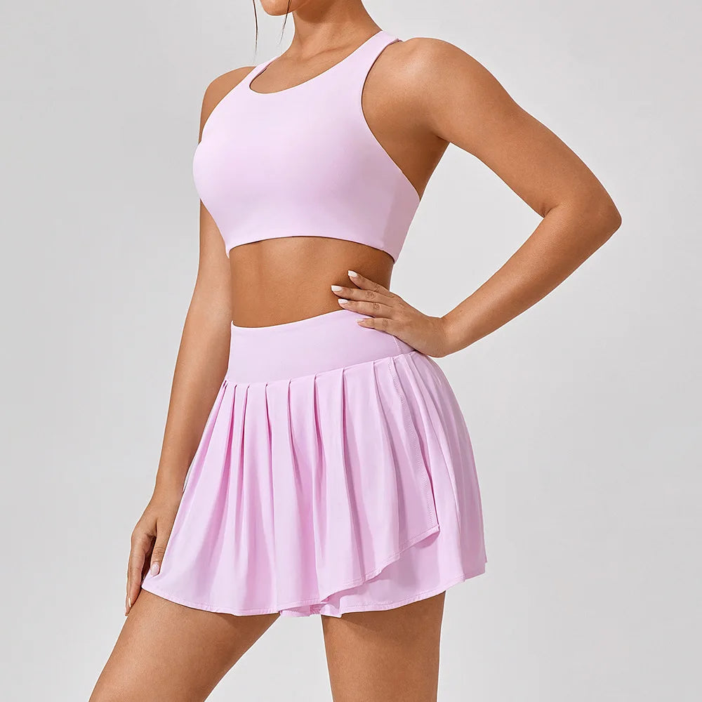 Clayside premium women’s tennis set featuring performance top, pleated skirt and lightweight court jacket, refined luxury tennis apparel