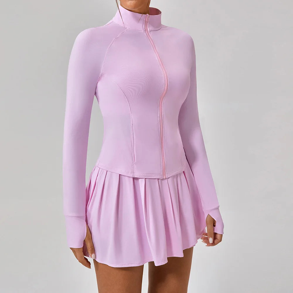 Luxury women’s tennis outfit featuring performance crop top, pleated tennis skirt and lightweight zip jacket, premium courtwear set designed for tennis and active lifestyle