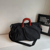 Premium tennis and pickleball travel bag designed for organized gear storage and effortless handheld or crossbody use