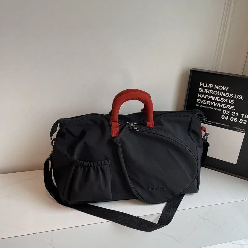 Premium tennis and pickleball travel bag designed for organized gear storage and effortless handheld or crossbody use