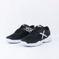 Close-up detail of refined tennis footwear featuring durable outsole construction and minimalist athletic styling