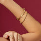 Editorial close-up of premium tennis bracelet with continuous radiant stones and sophisticated lifestyle styling