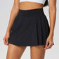Women's premium tennis skirt styled in an editorial tennis court setting blending luxury sportswear and performance
