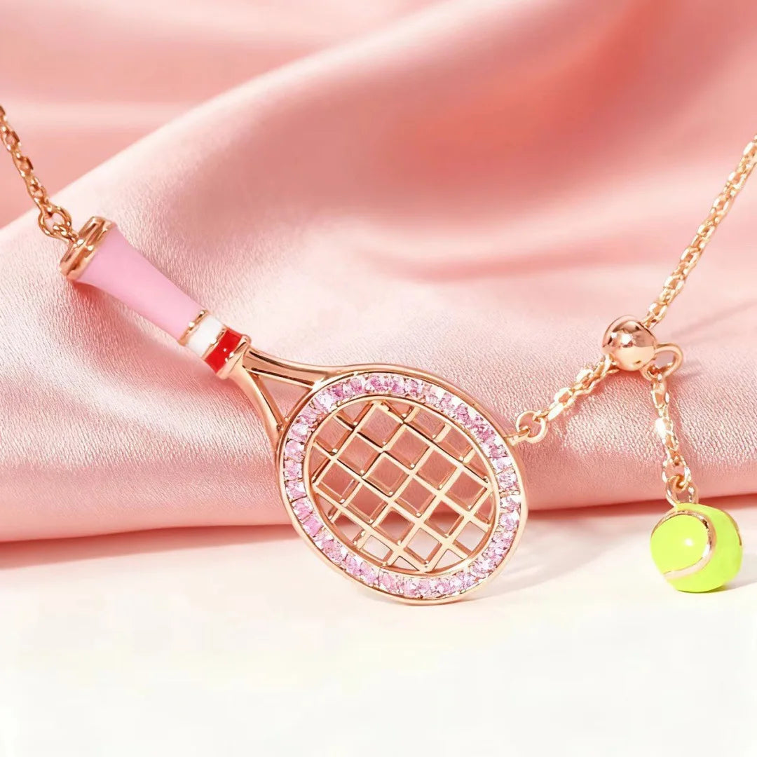 Editorial studio image of premium metallic tennis ball keychain featuring refined minimalist accessory design