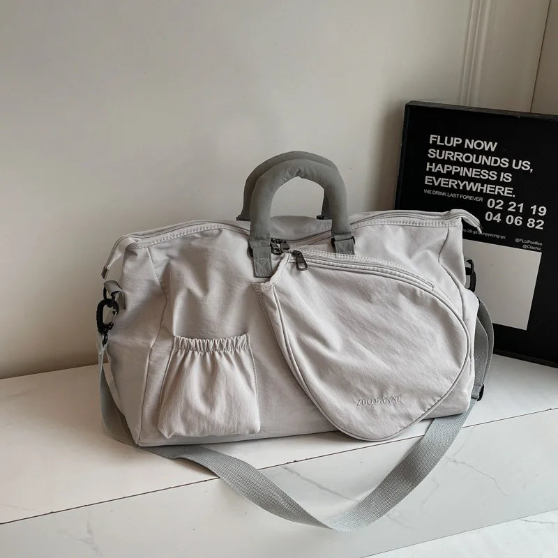 Lightweight performance travel bag with wet and dry separation compartments and refined athletic versatility