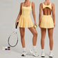 Women's premium sleeveless tennis dress with pleated skirt designed for performance, comfort and elegant court style
