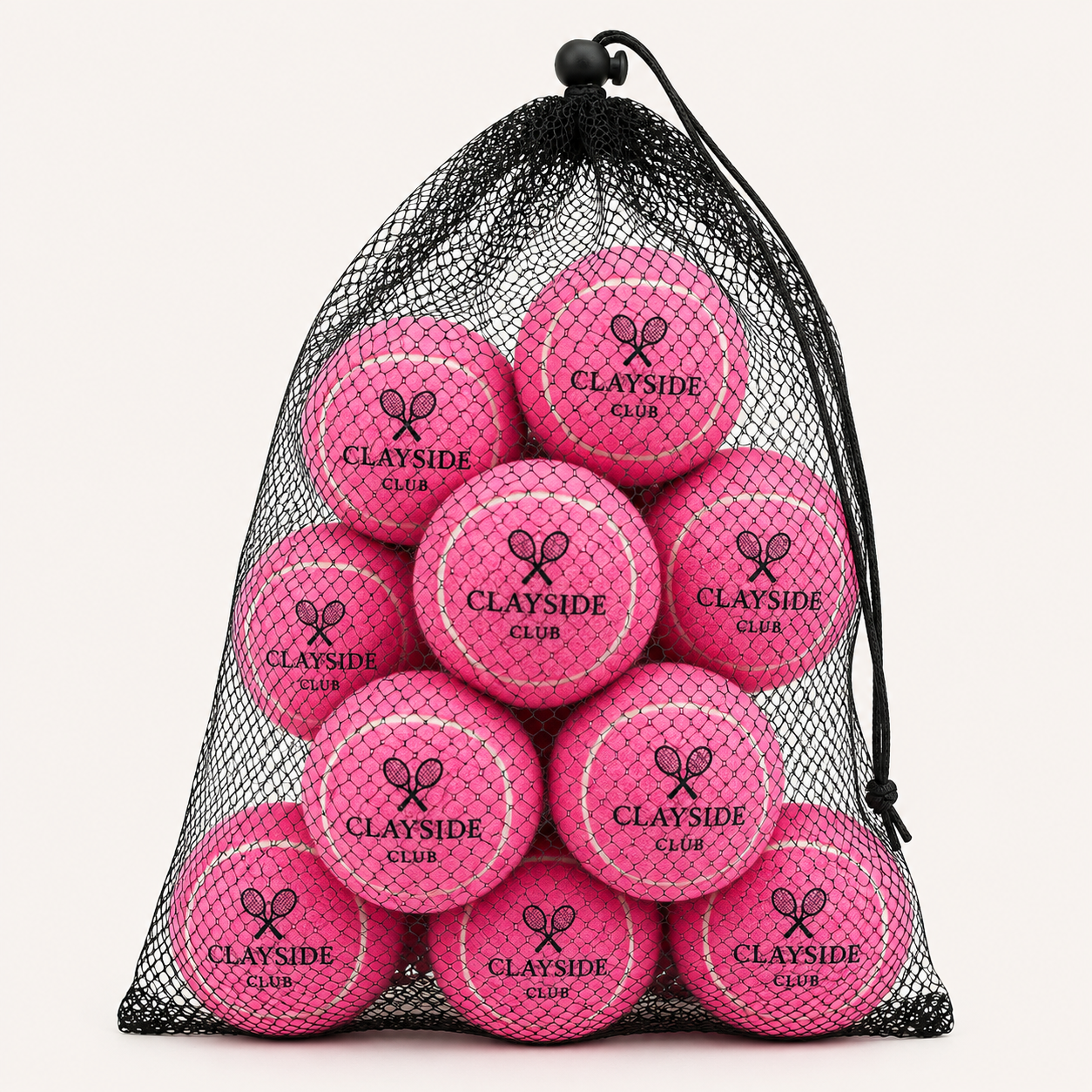Set of tennis balls with durable felt surface and mesh carry bag for regular court use and training routines