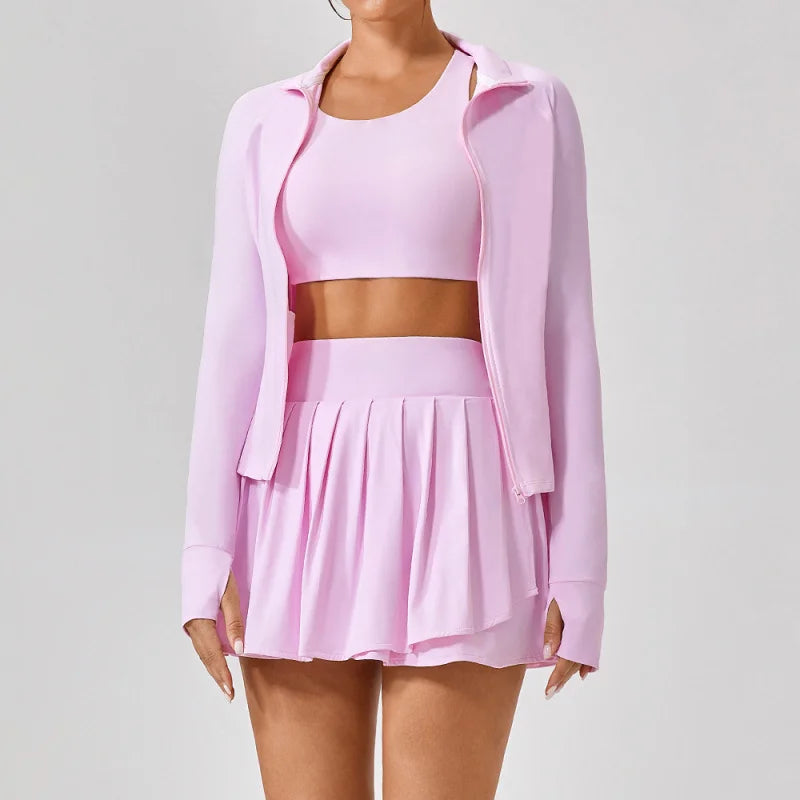 Premium women’s tennis apparel set with cropped performance top, pleated skirt and lightweight jacket, elegant luxury courtwear for modern tennis lifestyle