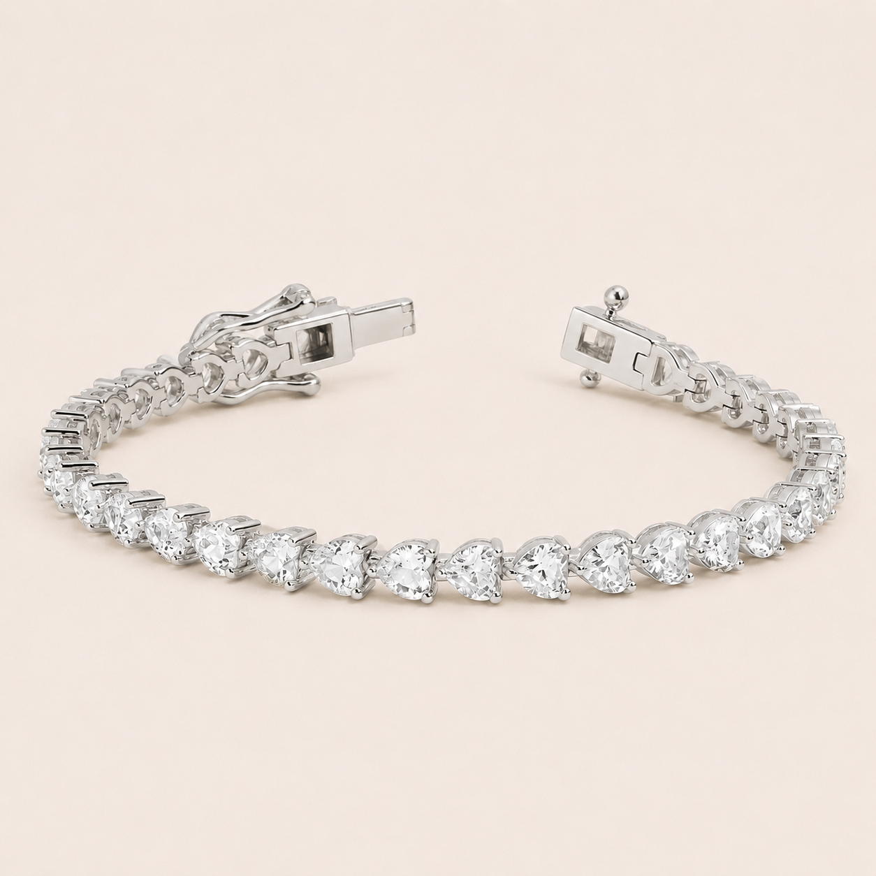 Editorial studio image of elegant white sapphire heart tennis bracelet with radiant minimalist luxury design