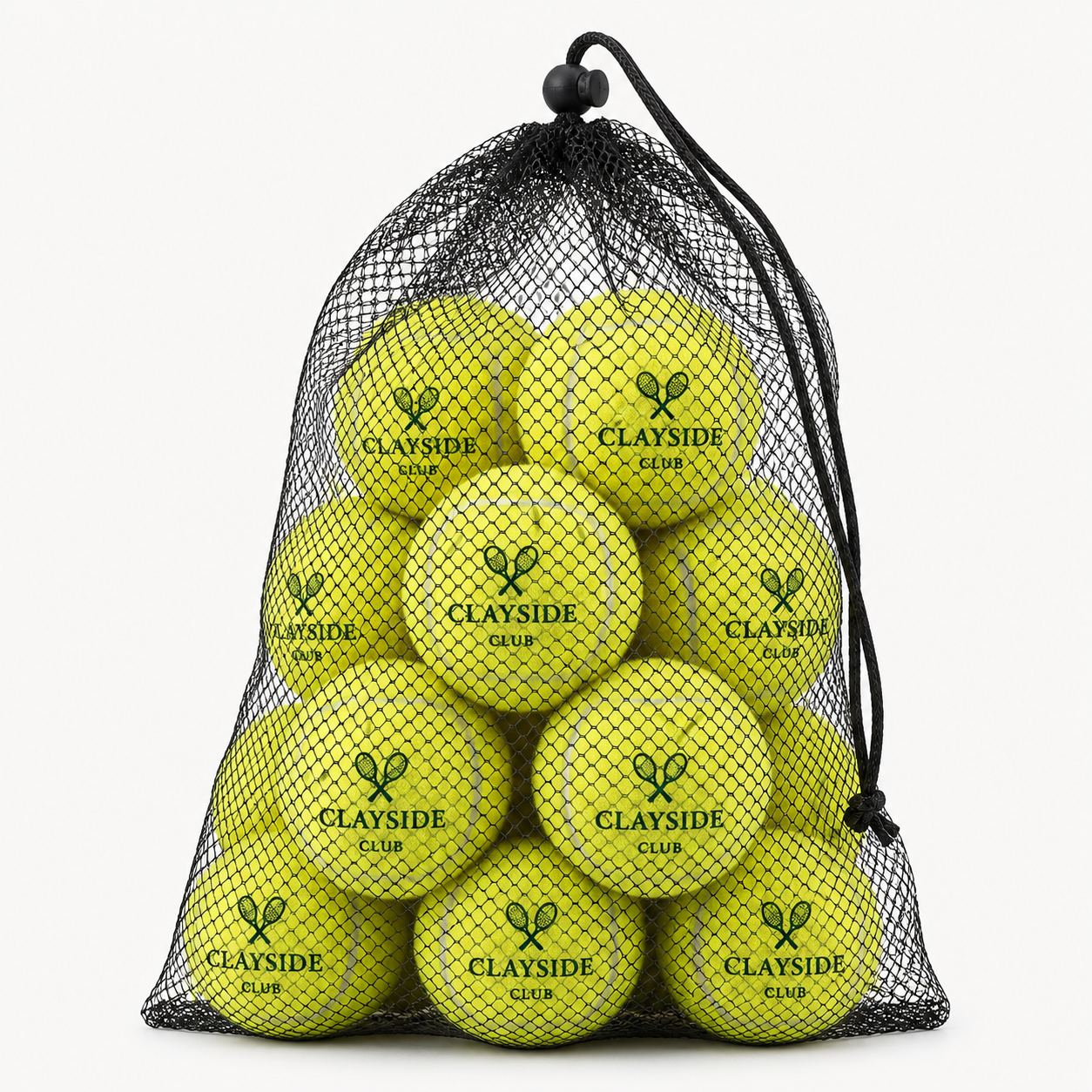 Editorial studio image of tennis balls and mesh storage bag with refined court-inspired presentation