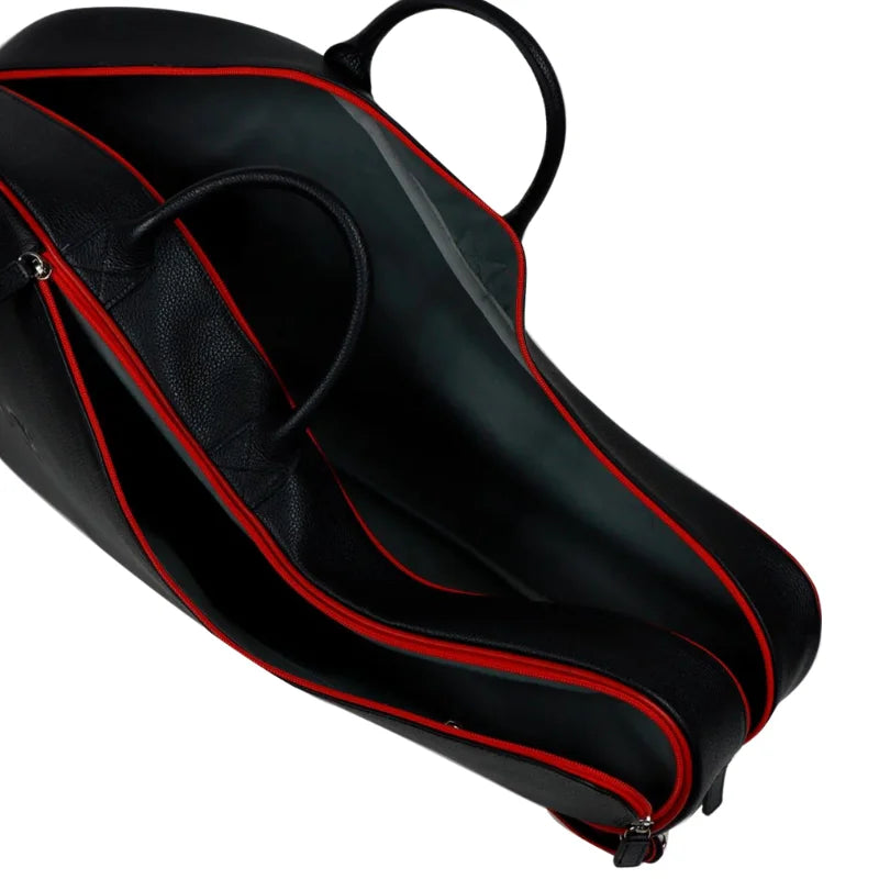 Premium cowhide leather tennis bag crafted for structured organization and sophisticated tournament-ready portability