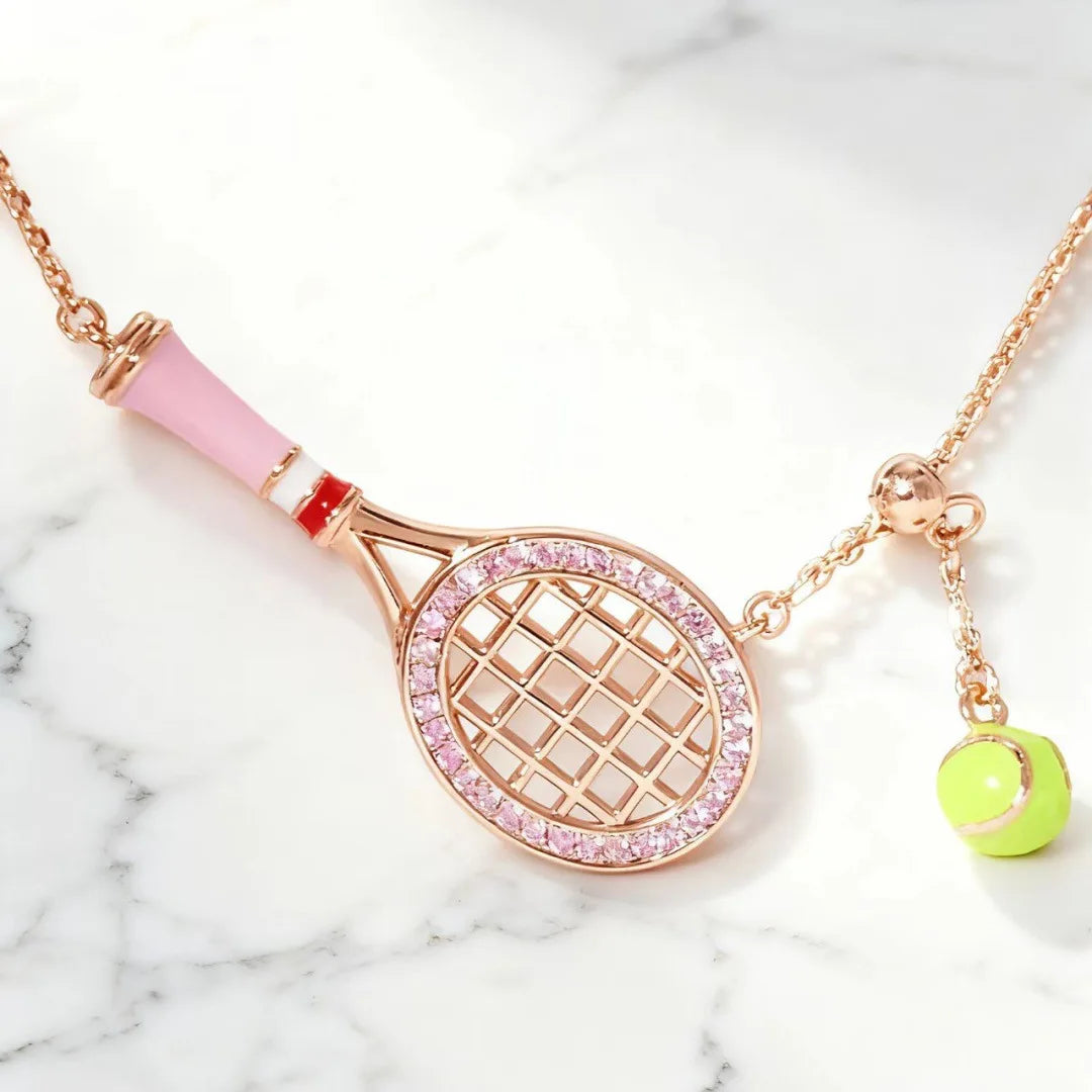Editorial close-up of premium tennis-inspired metallic keychain with polished finish and elevated everyday styling