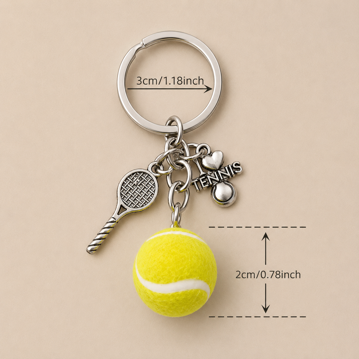 Close-up detail of premium tennis ball keyring with polished metal finish and understated court-inspired everyday style