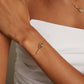 Close-up detail of premium tennis racket bracelet with luminous stone detailing and refined feminine styling