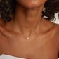 Close-up detail of premium tennis-inspired pendant necklace with polished finish and elegant everyday lifestyle aesthetics