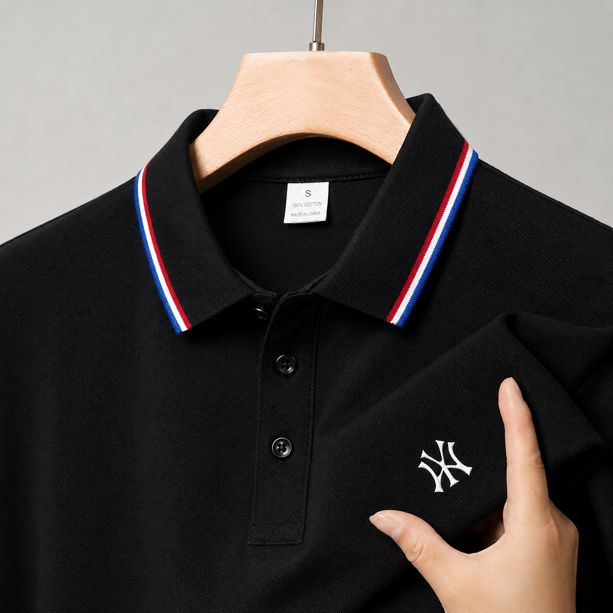 Close-up detail of men's premium tennis-inspired polo with breathable knit texture and tailored casual structure