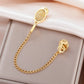 Editorial studio image of premium tennis racket and ball brooch featuring refined minimalist athletic sophistication