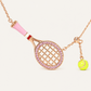 Premium metallic tennis ball keyring displayed in minimalist studio setting with refined sport-inspired aesthetic