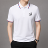 Men's premium knit polo with buttoned collar, streamlined silhouette, and understated sport-lifestyle elegance