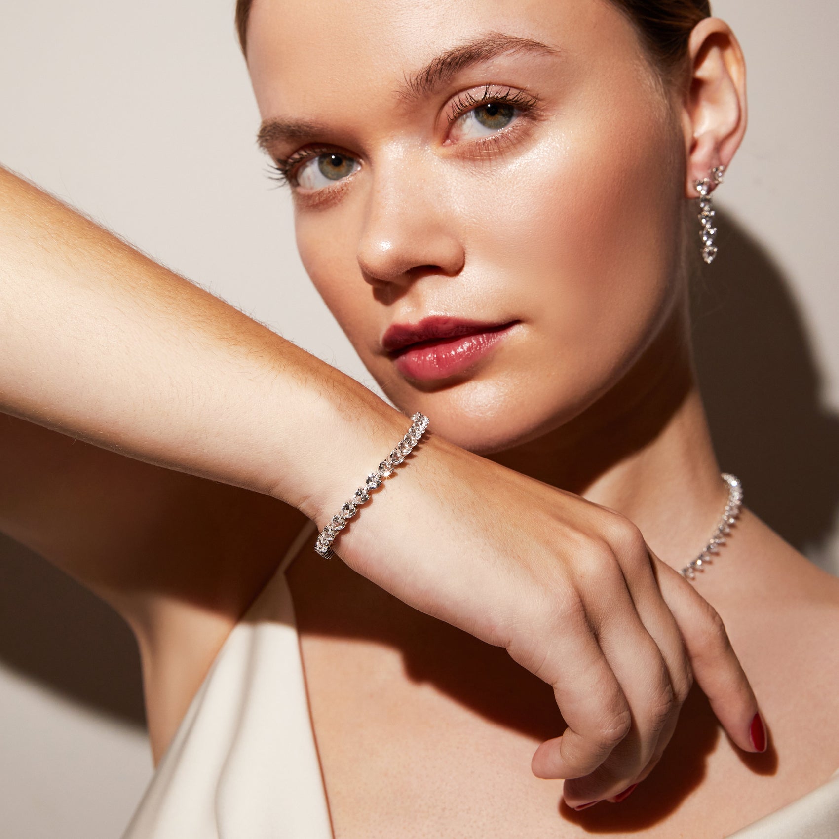 Luxury heart-inspired tennis bracelet crafted with luminous white stones and timeless modern styling
