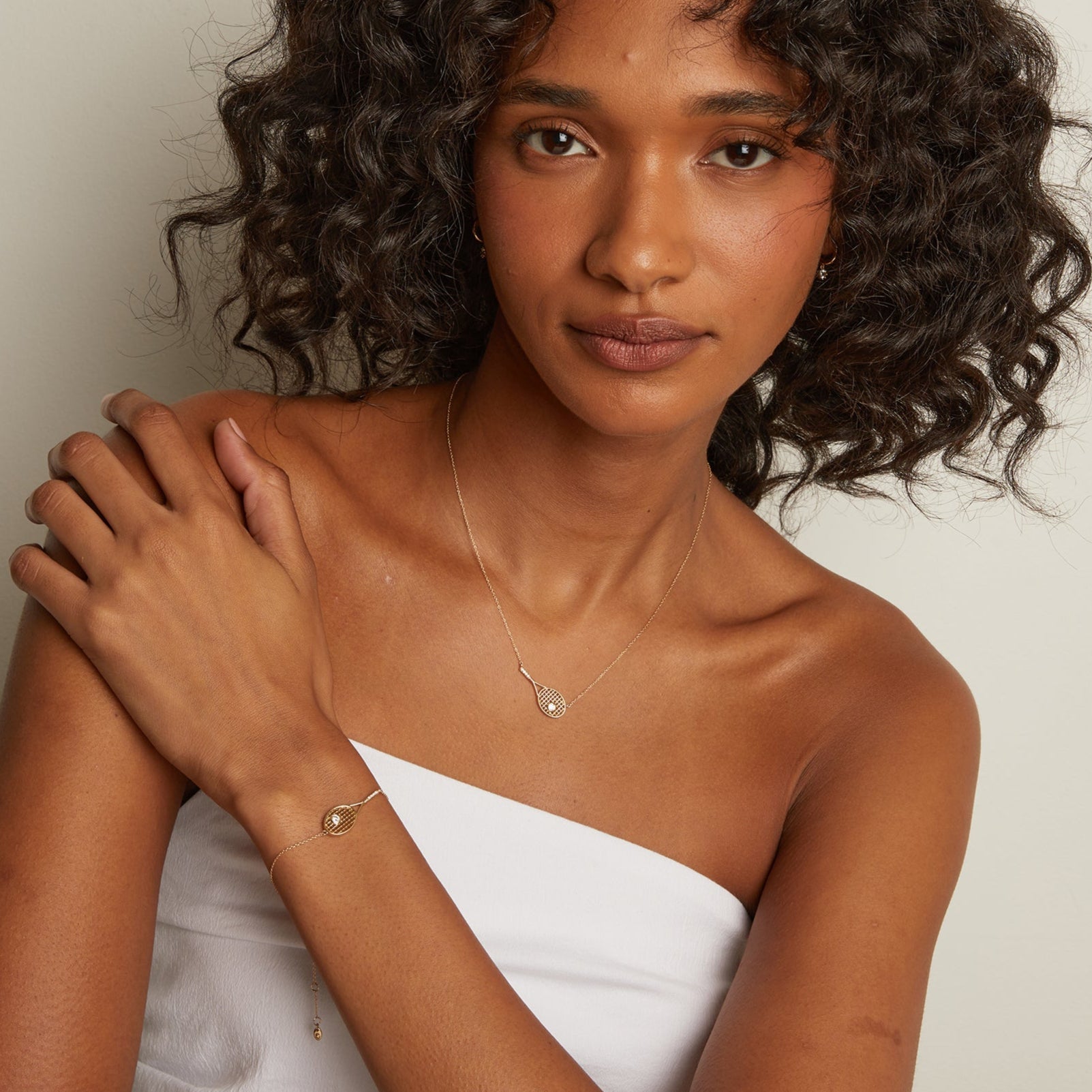 Premium tennis racket pendant necklace with luminous white stone detailing and lightweight everyday elegance