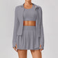Clayside premium women’s tennis set featuring performance top, pleated skirt and lightweight court jacket, refined luxury tennis apparel