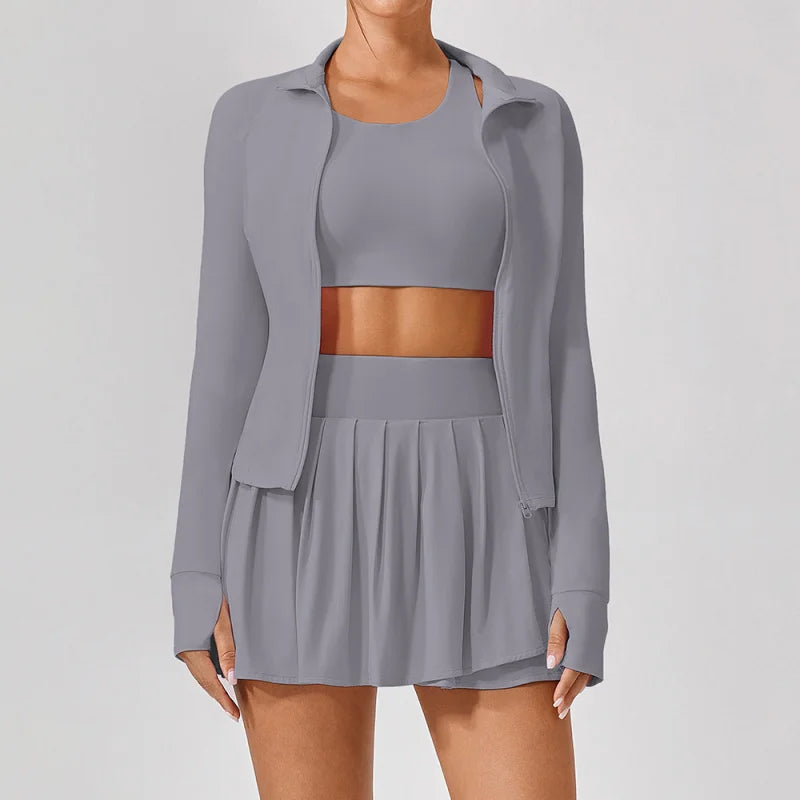 Clayside premium women’s tennis set featuring performance top, pleated skirt and lightweight court jacket, refined luxury tennis apparel