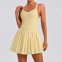 Stylish women's pleated tennis dress for performance training tennis matches and elevated court fashion