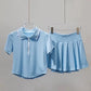 Athletic women's tennis ensemble designed for movement, comfort, and refined court style