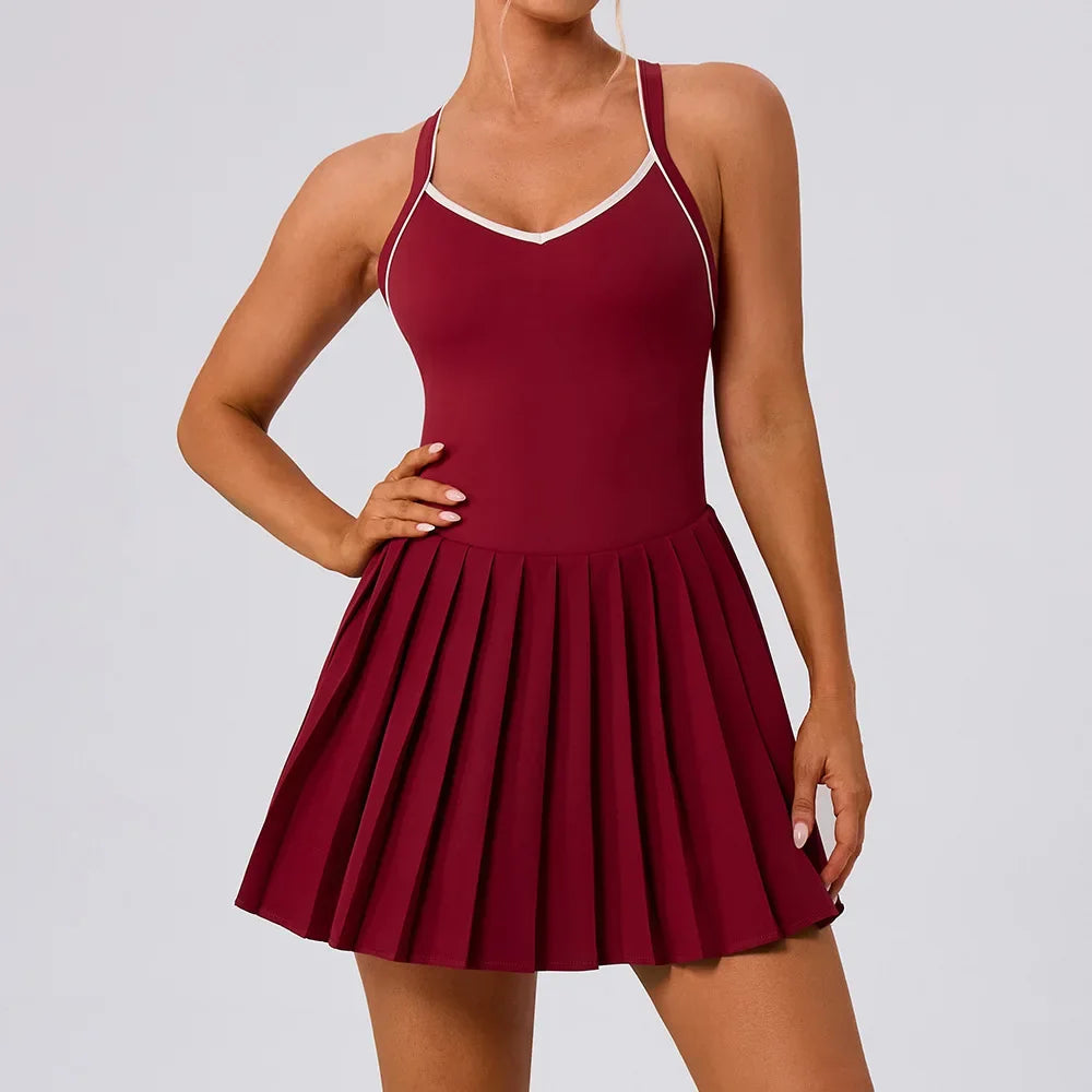 Women's elegant performance tennis dress photographed on tennis court with refined athletic design