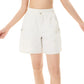 Professional tennis-inspired fashion image highlighting women’s premium athletic shorts in a court setting.