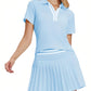 Women's luxury pleated tennis dress combining sleek athletic structure, refined design lines, and elevated performance wear styling.