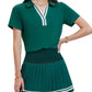 Women's premium tennis dress designed with elevated athletic elegance, flowing pleated skirt, and timeless luxury sport styling.