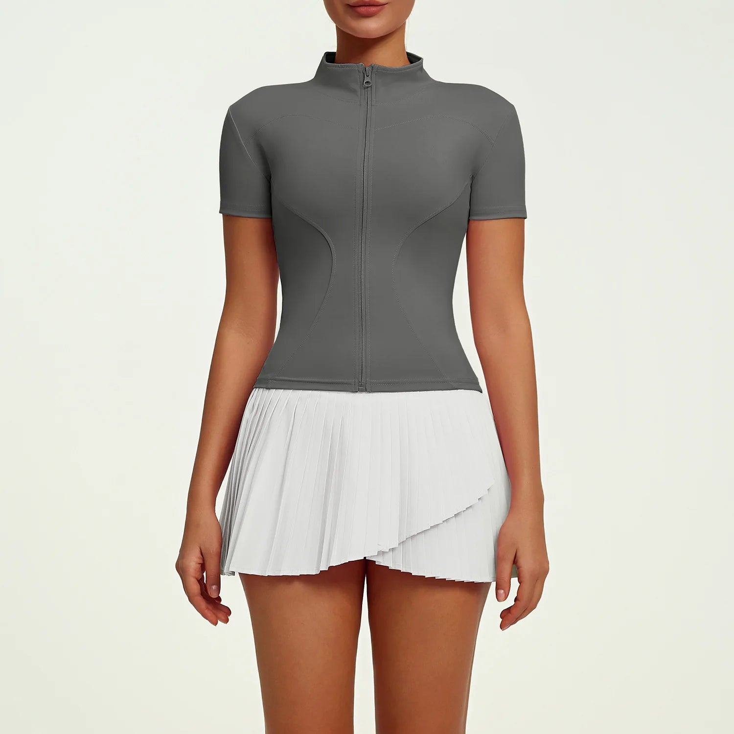 Women's refined tennis lifestyle set featuring fitted performance top and pleated skirt, combining elegant silhouette, freedom of movement and premium comfort.