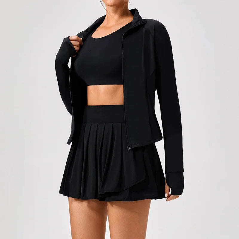 Clayside premium women’s tennis set featuring performance top, pleated skirt and lightweight court jacket, refined luxury tennis apparel