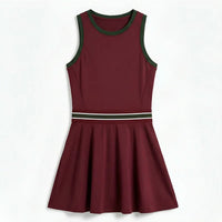 Women's tennis dress with integrated shorts, soft performance fabric, and structured fit designed for movement on court.