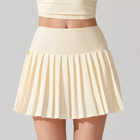 Elegant female tennis player wearing a performance tennis skirt while resting between tennis sessions