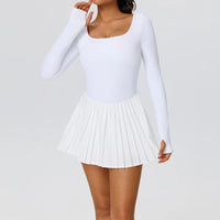 Elegant women's long sleeve tennis dress designed for athletic movement, refined comfort, and premium court-inspired style.