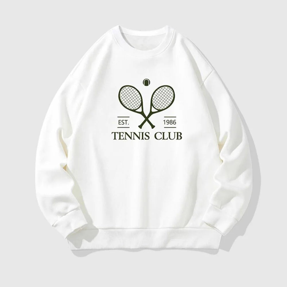 Stylish female athlete wearing modern tennis clothing on a professional tennis court, combining performance comfort with elevated sportswear design.