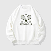 Stylish female athlete wearing modern tennis clothing on a professional tennis court, combining performance comfort with elevated sportswear design.