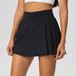 Female tennis player wearing a premium performance tennis skirt on court in an elevated athletic editorial setting