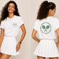 White women’s tennis t-shirt by Clayside with front logo and back graphic.